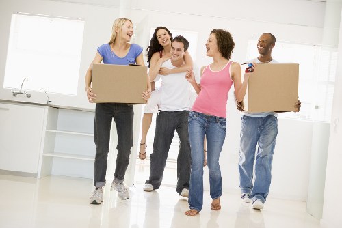House movers loading furniture for a home move in Haggerston