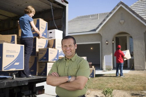 East London man and van loading boxes safely