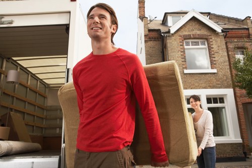 Local moving team loading boxes for a Haggerston house move